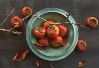Puzzle Persimmon on the plate