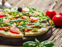 Jigsaw Puzzle Pizza with ruccola