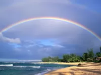 Rompecabezas Rainbow over the beach