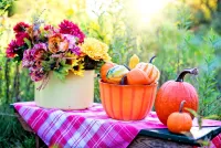Puzzle Autumn flowers with pumpkins