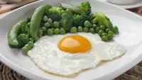 Puzzle scrambled eggs with vegetables