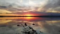 Rätsel Sunset over the lake